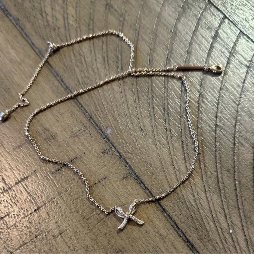 Kendra Scott rose gold bow Sasha necklace comes with pouch and box
